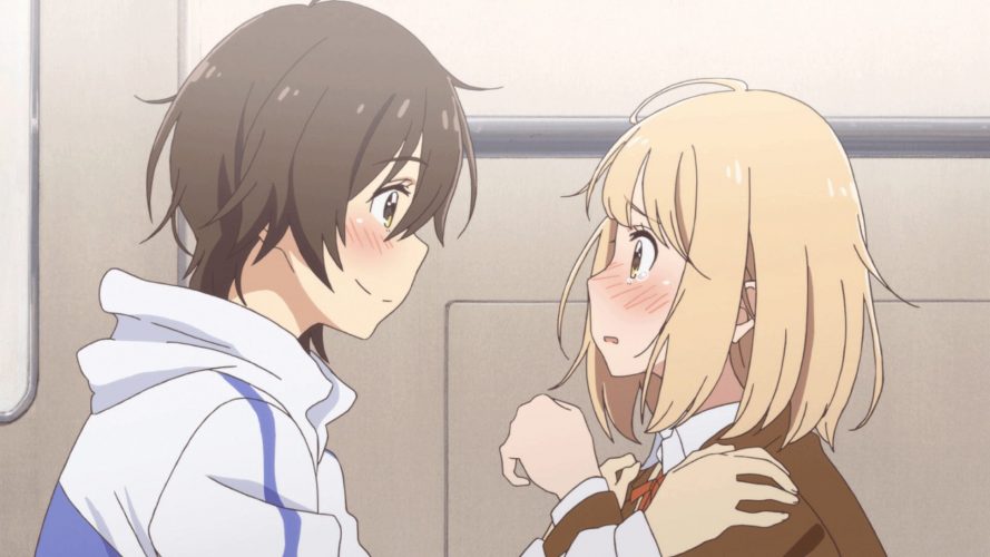 Kase and Yamada staring at each other, Kase smiling and Yamada looking emotional.